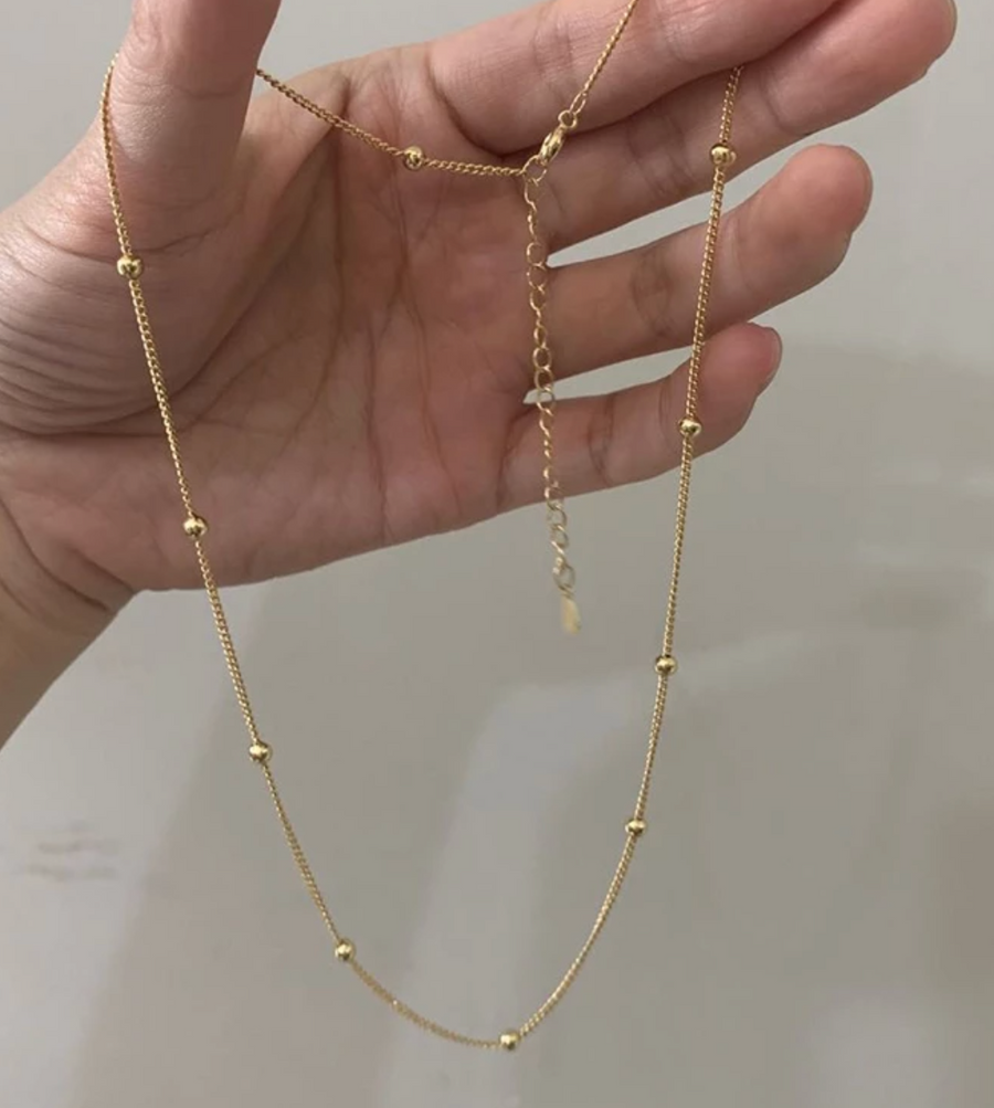 Necklace with small balls